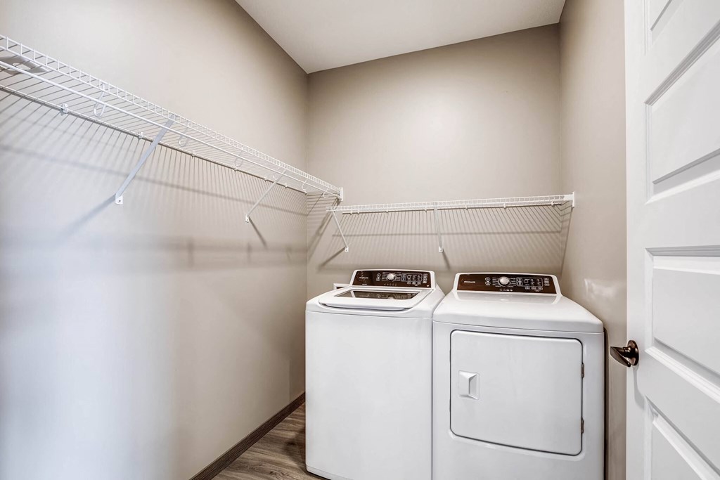 a laundry room with washer and dryer in it