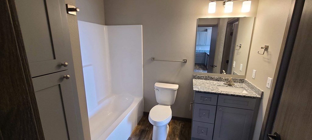 a bathroom with a sink toilet and a bath tub