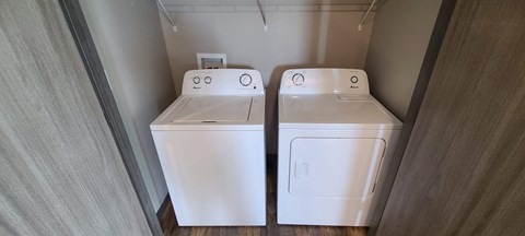 a white washer and dryer in a room