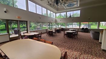 a large room filled with tables and chairs