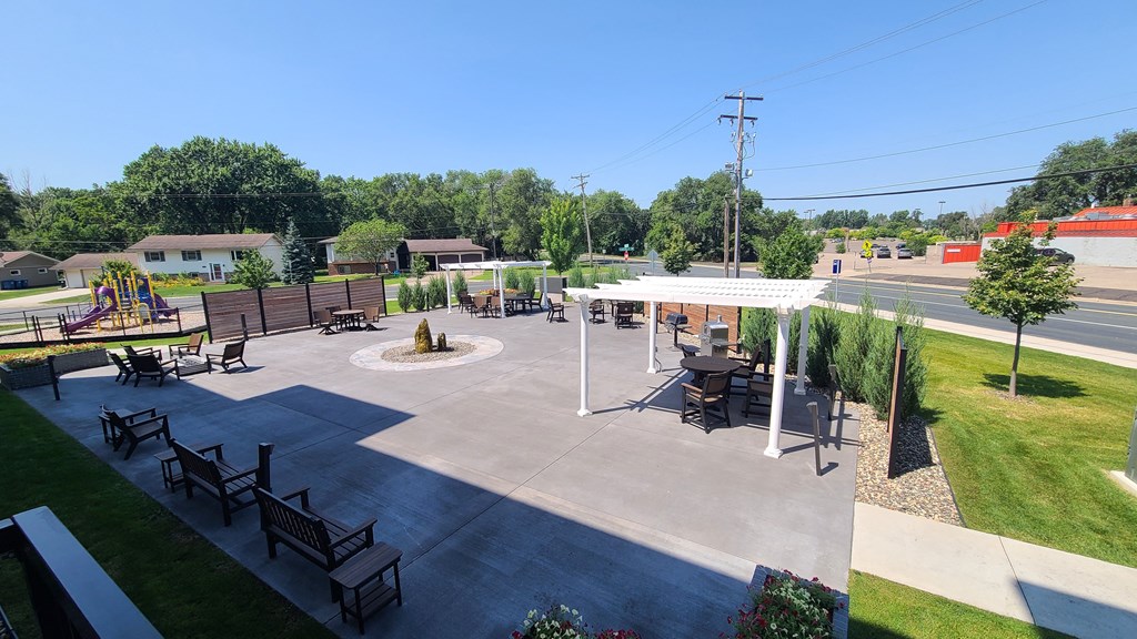 a park with a picnic area and a fire pit