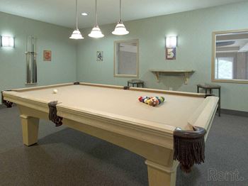 a pool table in the game room