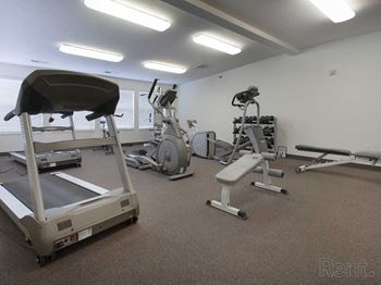 a gym with weights and other exercise equipment
