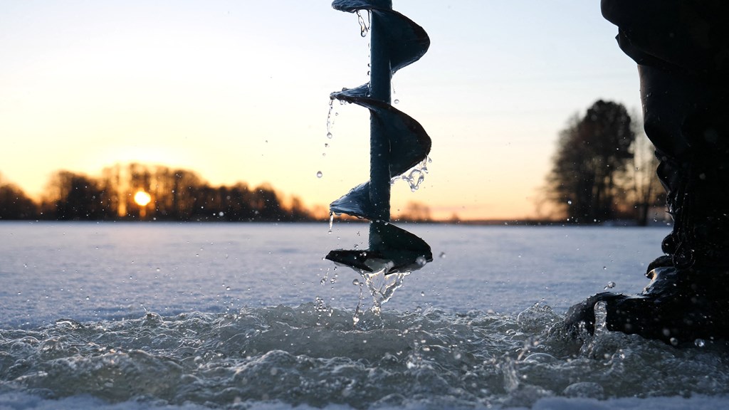 Driling a hole for ice fishing