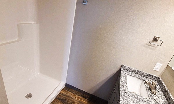 a bathroom with a sink and a shower in it