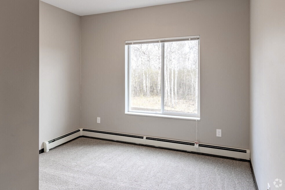 an empty room with a large window in it