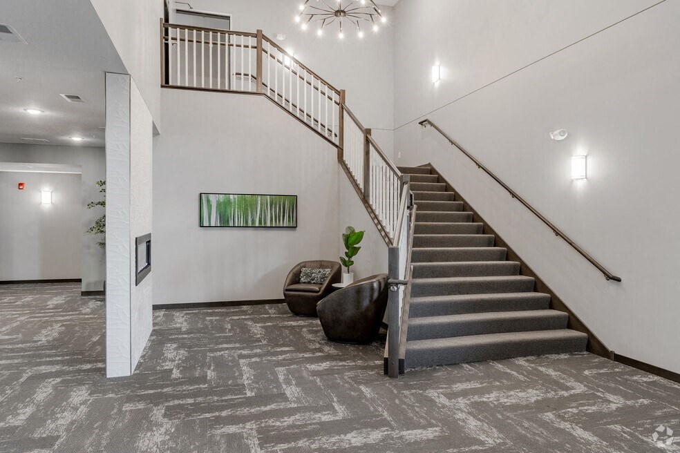theoyer of a house with a staircase and carpeted stairs