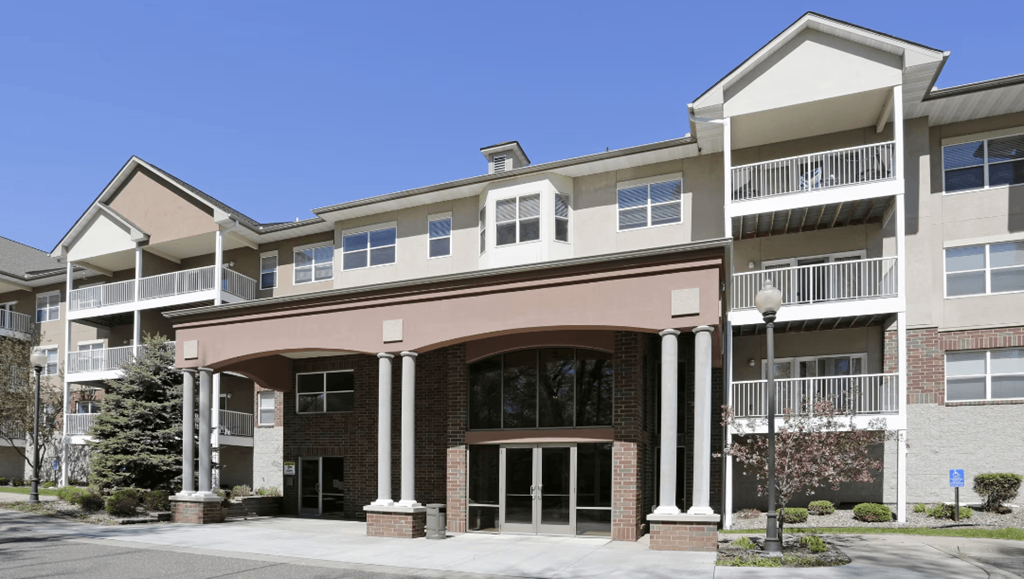 a picture of a building with a blue sky in the background