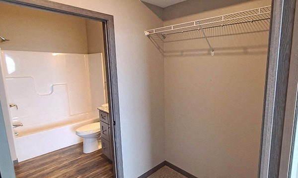a bathroom with a toilet and a shower in it
