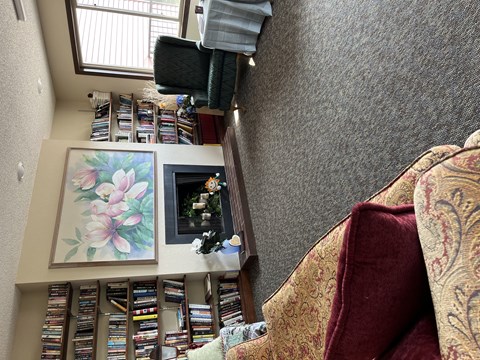 A living room with a couch and a television.