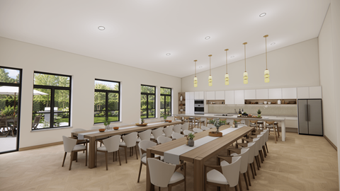 A modern dining room with a long table and chairs.