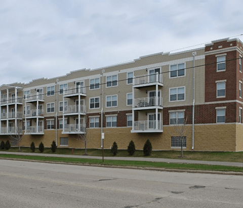 an apartment building on the side of a street
