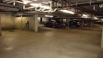 a parking garage with cars parked in it