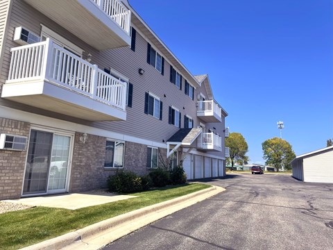 Apartment building with a clear blue sky above.