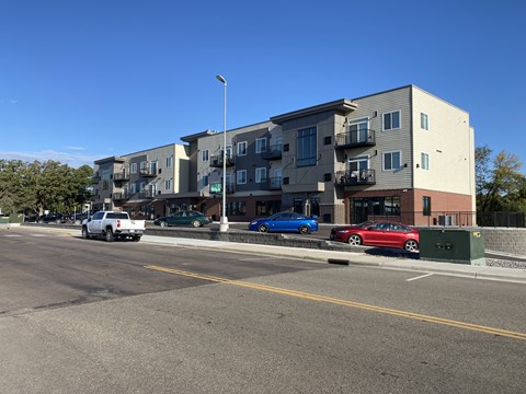 an apartment building on the side of a street