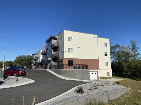 a building with a red car parked in front of it