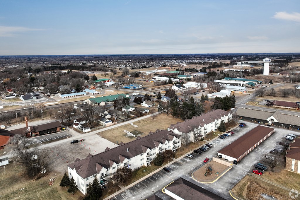 BLDG A/C - A small town with a lighthouse in the distance.