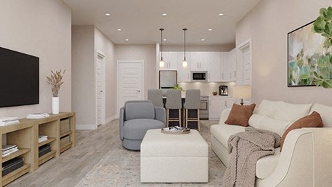 a living room with a couch and a chair and a kitchen
