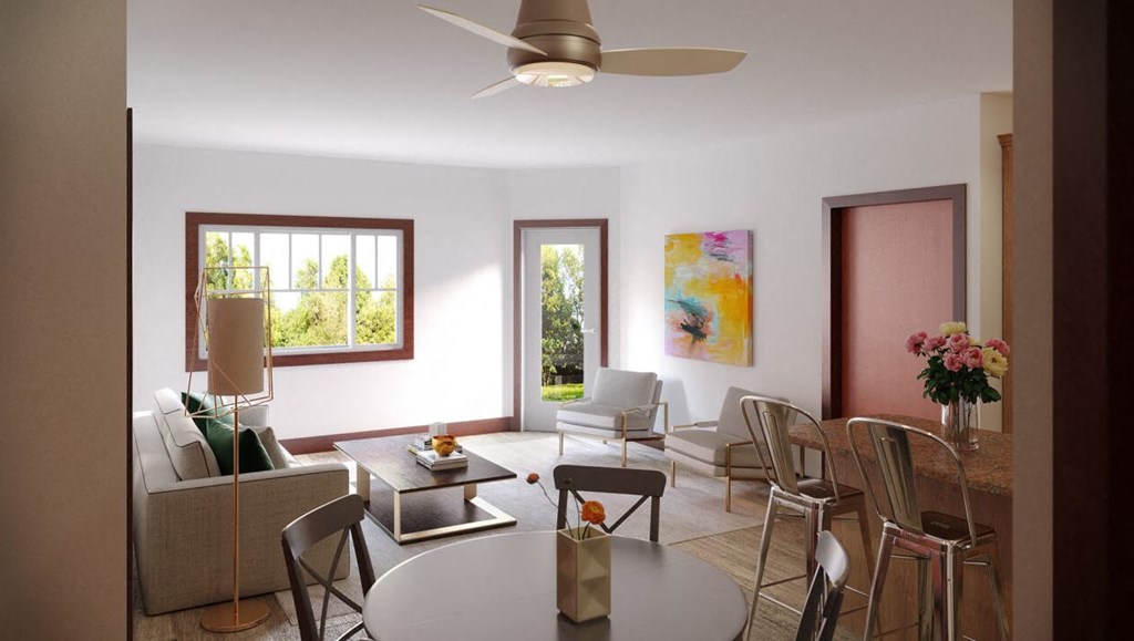 a living room and dining room with a table and chairs