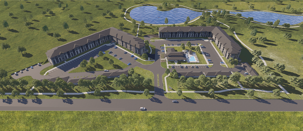 an aerial view of a large building with trees and a lake