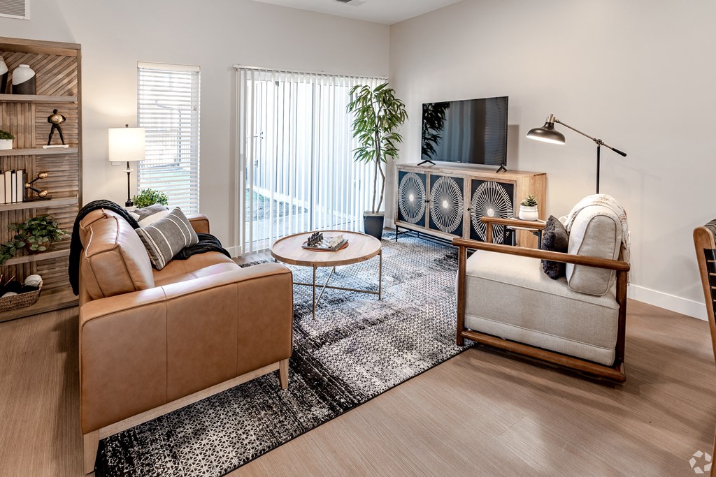an open living room with a couch and a tv