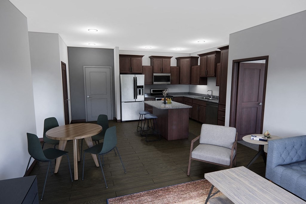 A kitchen with a table and chairs in the middle of the room.