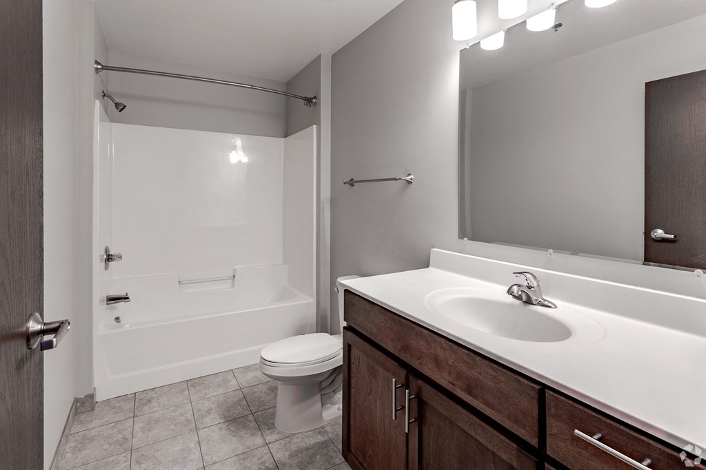 a bathroom with a sink toilet and a shower