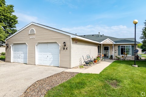 A house with a garage and a driveway.