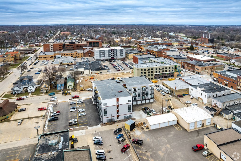 A cityscape with buildings and cars.