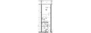 A floor plan of a small apartment with a living room, kitchen, bathroom, and laundry area.