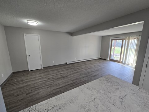 A room with a door and a window.