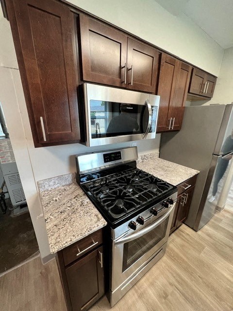 a kitchen with a stove and a microwave
