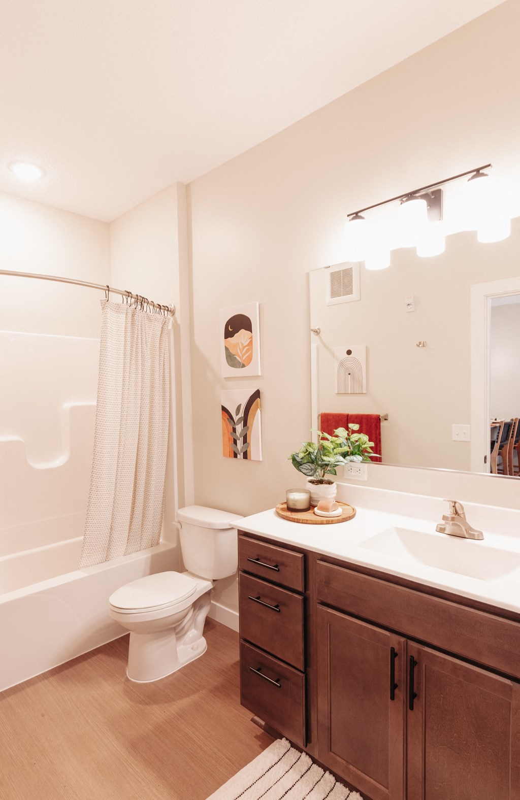 a bathroom with a sink and a toilet and a shower