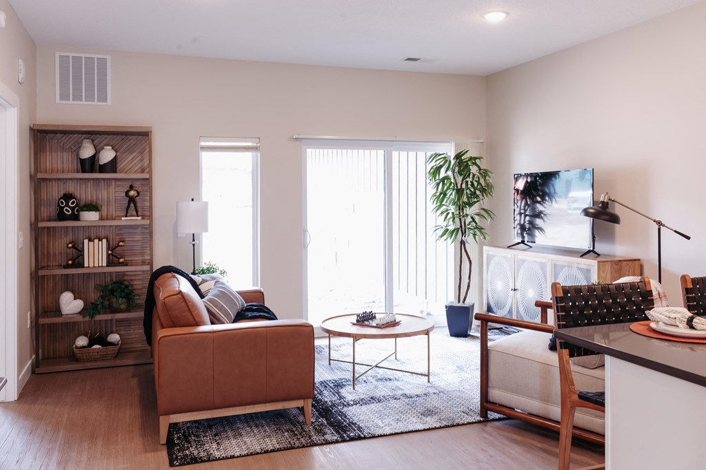 a living room with a couch and a table and a fireplace