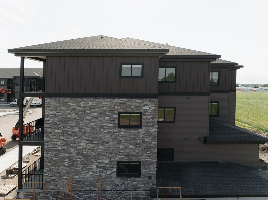 a view of the back of a house from the roof of a building
