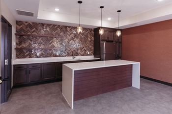 a kitchen with a counter top and a refrigerator