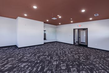 an empty room with white walls and a door