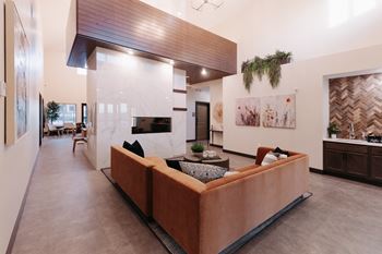 a living room with a couch and a fireplace
