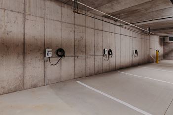 the inside of a parking garage with parking meters