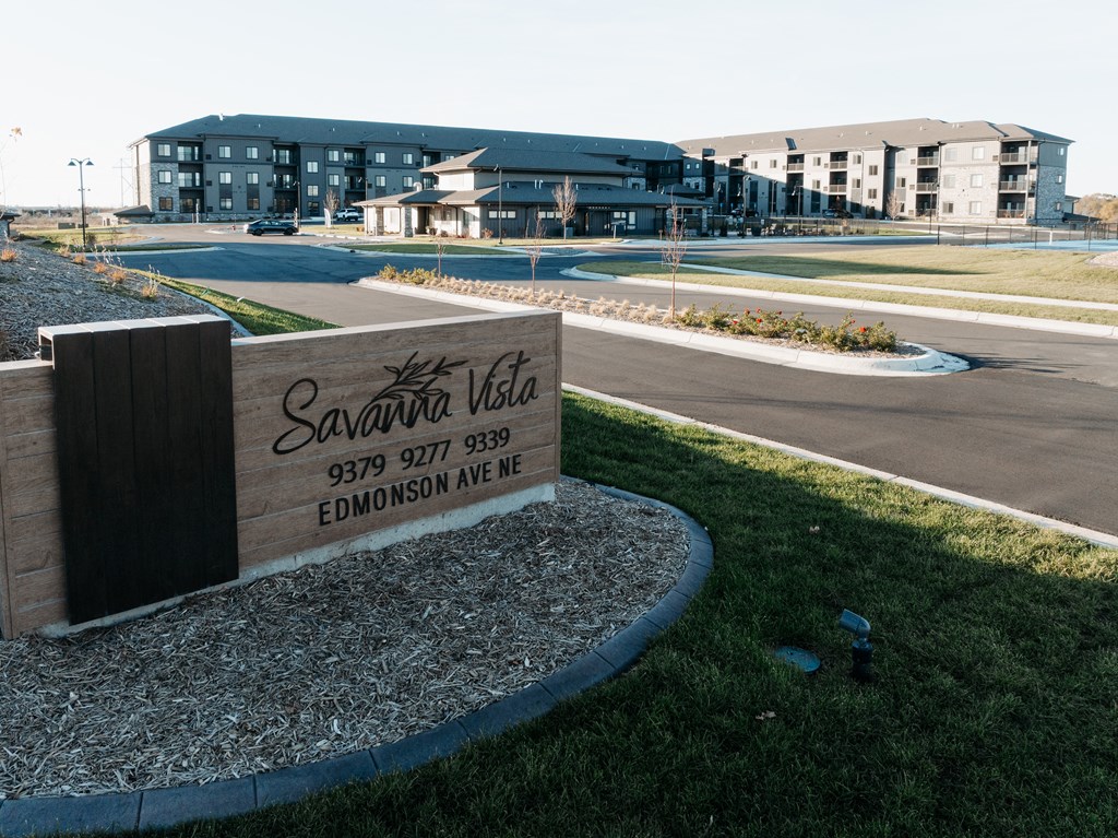 a sign that reads apartments in front of a building