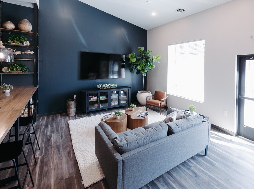 a living room with a couch and a tv