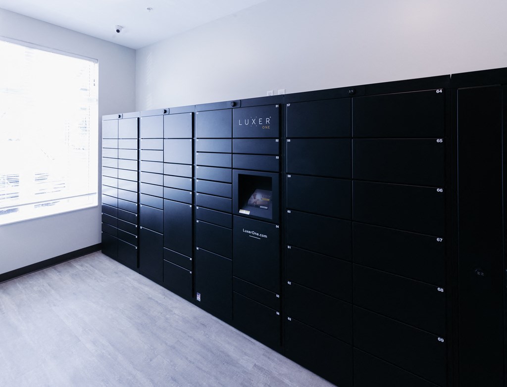 a large set of black lockers in a room