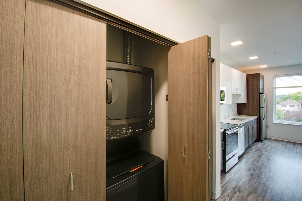 A kitchen with a black oven and a black microwave.