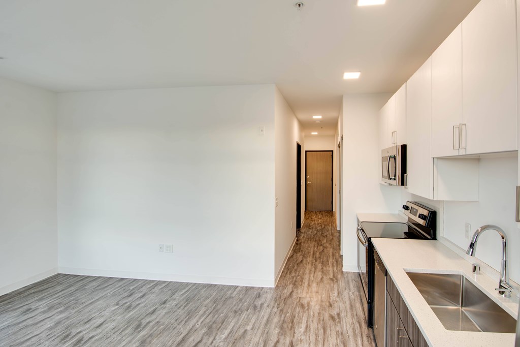 A kitchen with a sink and a counter top.