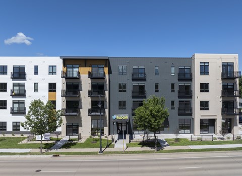 A modern apartment building with a sign that says "BIG".
