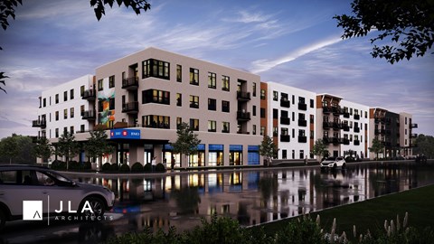 A modern building with a reflection in the water in front of it.