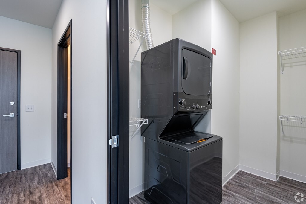 A black oven is built into a kitchen island.