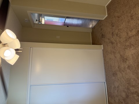 A white closet door is open.