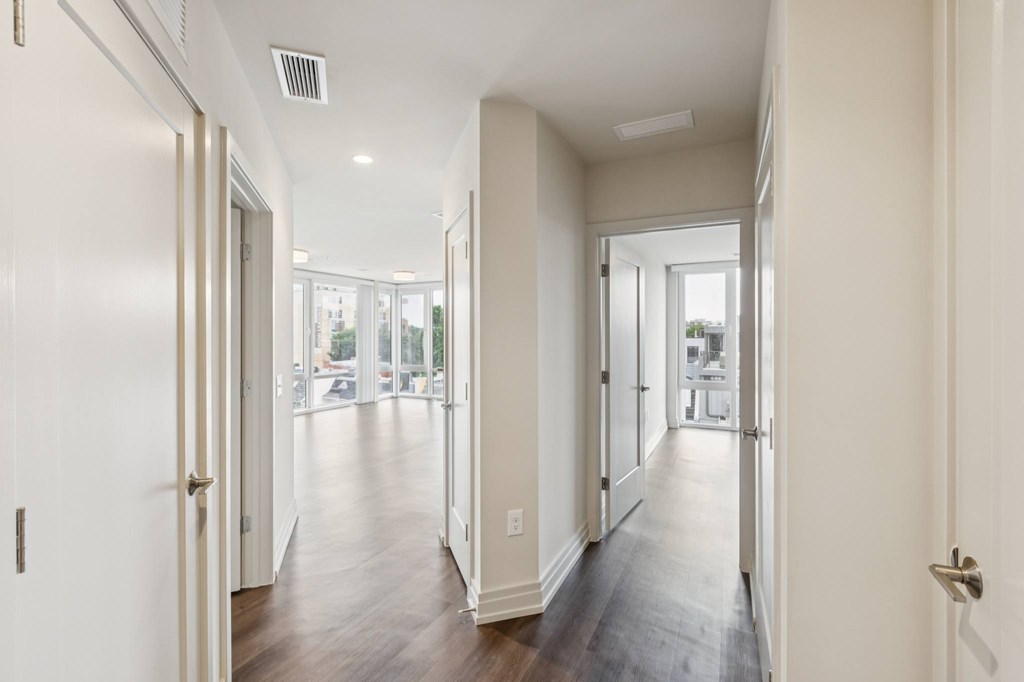 A long hallway with doors on both sides.