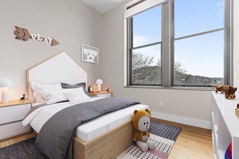 a bedroom with a bed and a large window